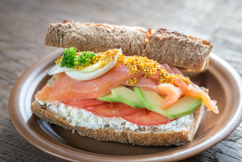 Sandwich with salmon, avocado and eggs