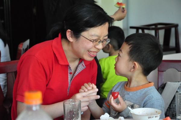 Beijing-Feeding Orphaned Children